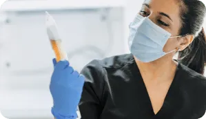 Holistique IV pharmacist preparing a compounded infusion