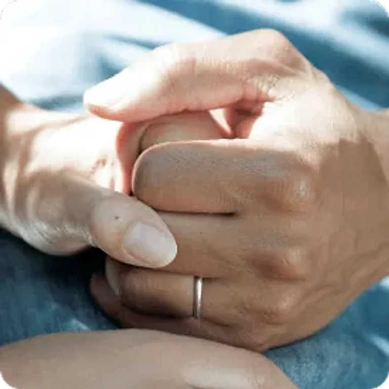 Hands held in support, integrative cancer supportive care at Holistique Medical Center, Bellevue