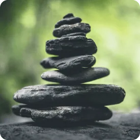 Stacked balanced stones, symbol of naturopathic medicine at Holistique Medical Center, Bellevue